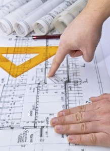 Architect rolls and plans blueprints home building concept