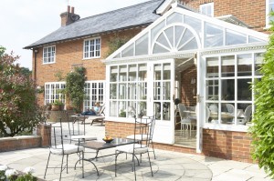 Exterior Of House With Conservatory And Patio