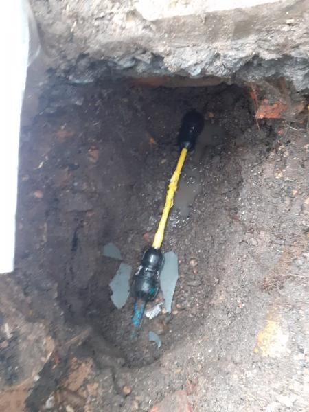 Burst lead pipe below ground